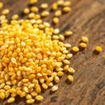 High-quality hulled sesame seed display showing golden seeds ready for packaging and culinary
